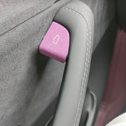 Premium colorful suede door open button cover stickers applied to a Tesla interior door panel, showing a precise cut matching the door release switch.