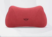 A red neck pillow with a black Mini logo in the center, shown on a light gray background with a small inset showing a close-up of the red fabric texture and Chinese text.