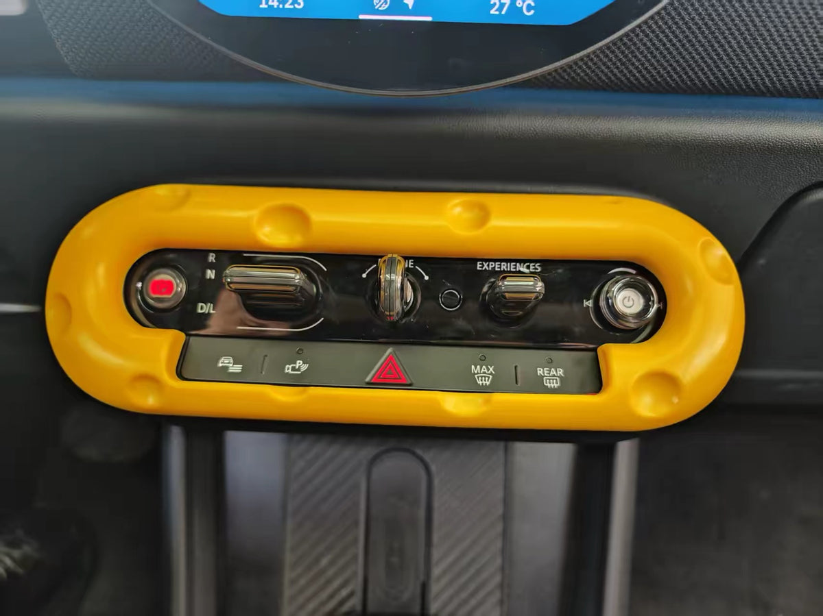cheese-style center console decor cover installed on a MINI Cooper dashboard