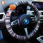 Boho striped fabric steering wheel covers with dachshund patches and fluffy pom poms in Gray