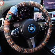 Boho striped fabric steering wheel covers with dachshund patches and fluffy pom poms in Chocolate