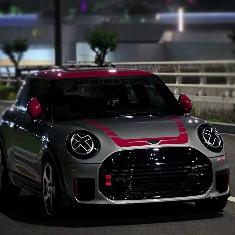 White X headlight decal sticker applied to Mini Cooper front headlights showing comic manga style effect