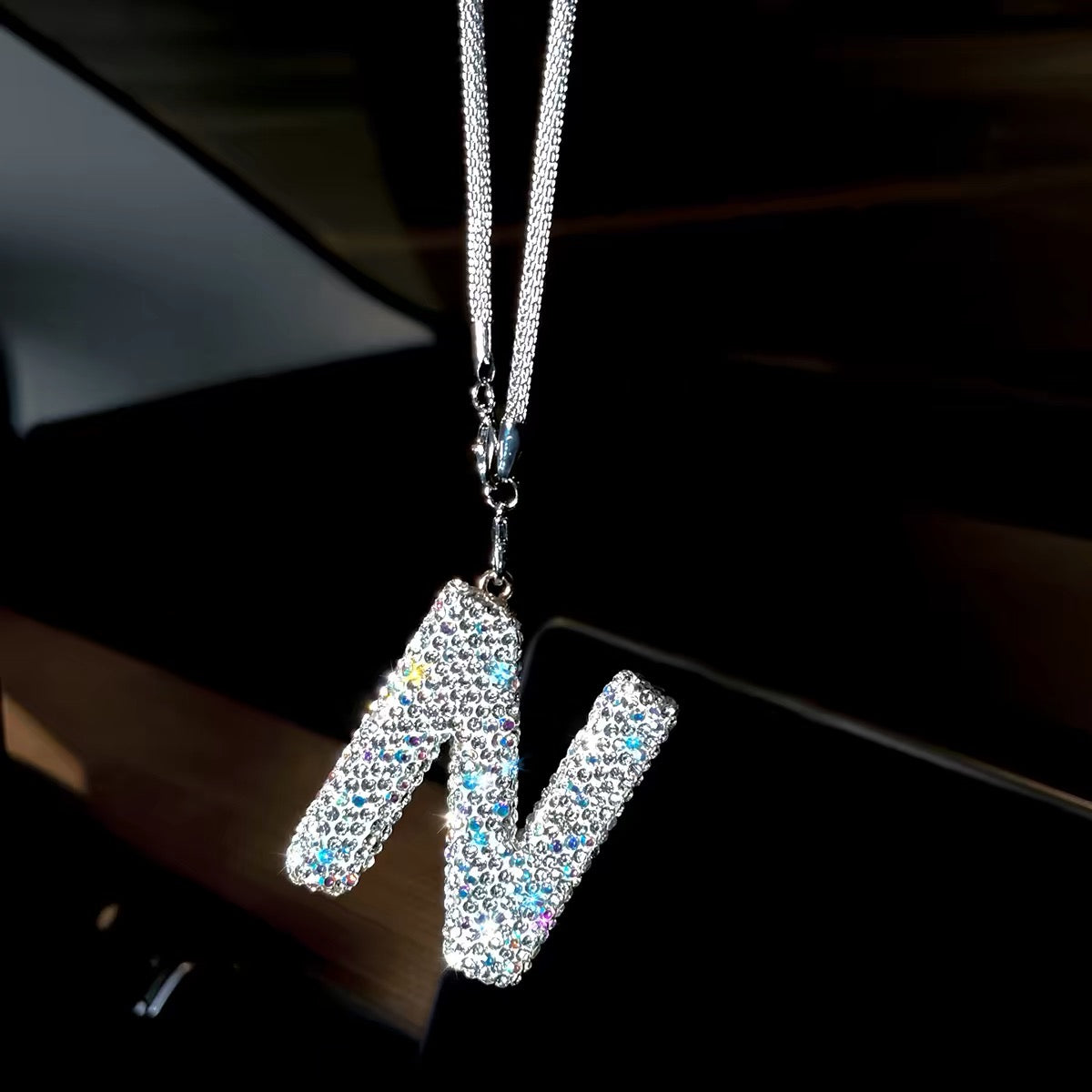 Rhinestone letter charm paired with heart and feather pendant hanging together on car rearview mirror Letter N