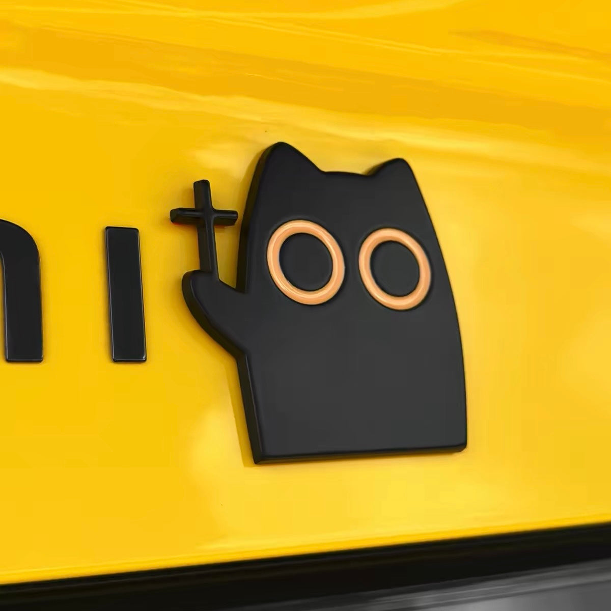 Funny black cat metal badge next to tailgate lettering