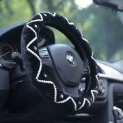 Steering wheel with decorative cover inside a car