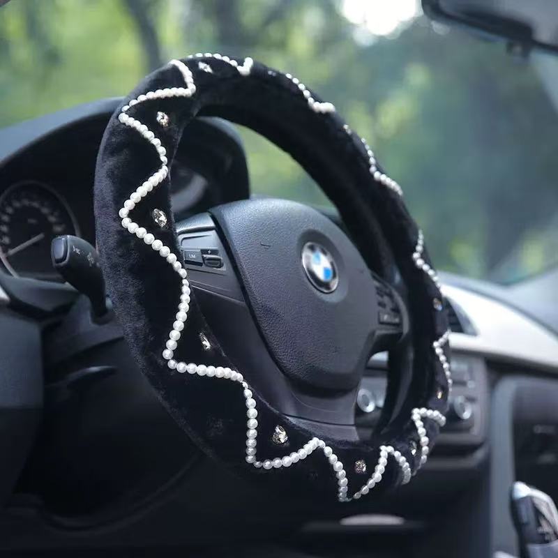 Steering wheel with decorative cover inside a car