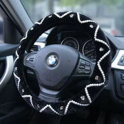 Steering wheel cover with decorative patterns on a car steering wheel
