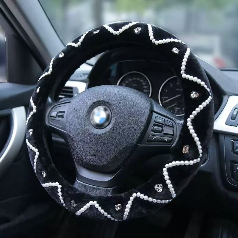 Steering wheel cover with decorative patterns on a car steering wheel