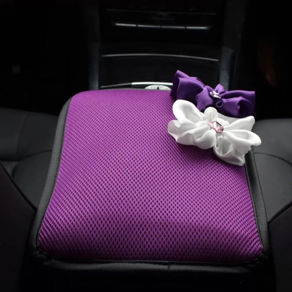 a purple bag is sitting on a purple suitcase 