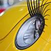 a close up of a yellow car tire 