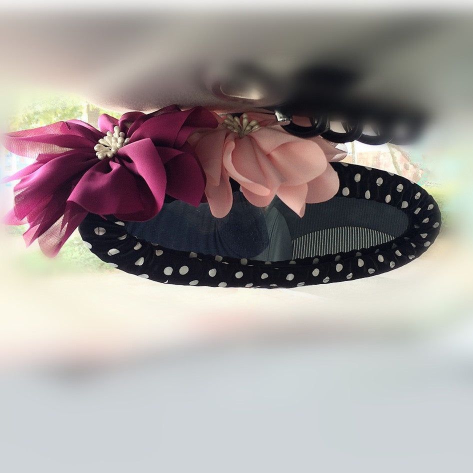 a chocolate cake with pink flowers on it 