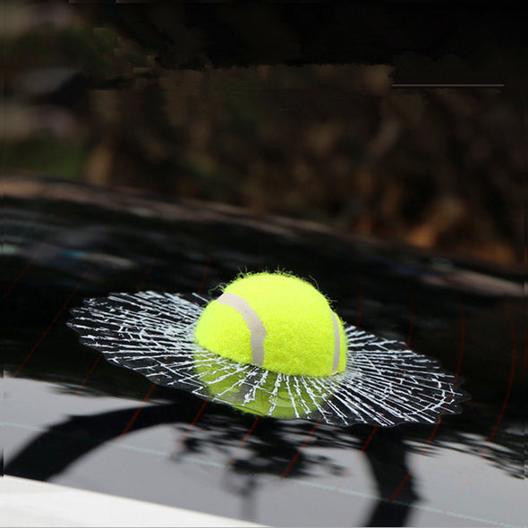 a close up of a tennis ball on a tennis racket 